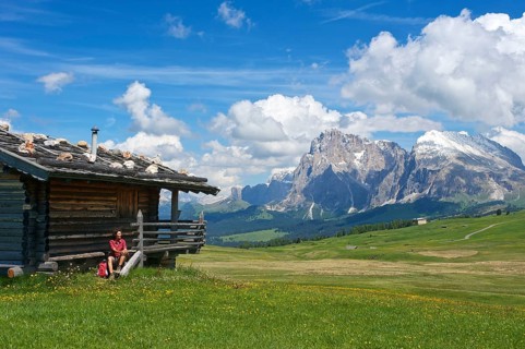 Alpine huts on the Alpe di Siusi with Sassolungo and Sassolungo