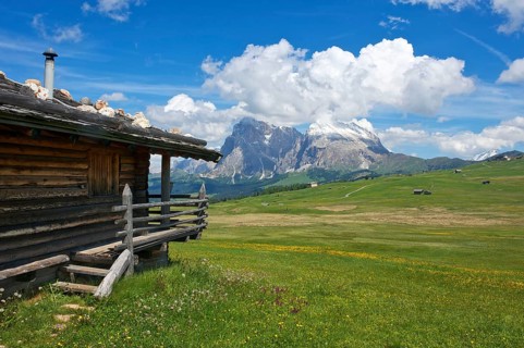Alpine huts on the Alpe di Siusi with Sassolungo and Sassolungo