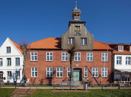 Old historic half-timbered house at the old historic harbour of Toenning