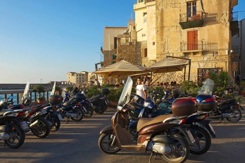 Vespas on the outskirts of the old town of Cefalu