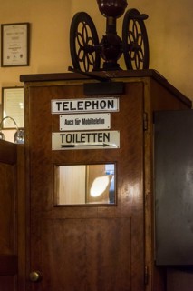 Old telephone booth in coffee house