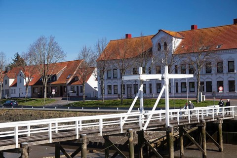 The old historic white bridge over the Toenning peat harbour