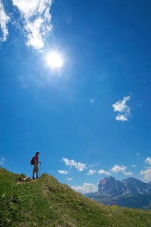 Hiking on the Seceda with view of Langkofel and Plattkofel