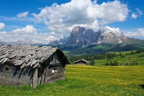 Alpine huts on the Alpe di Siusi with the Sella Group