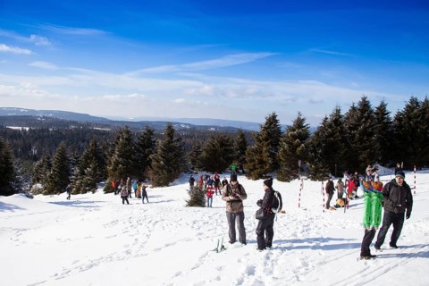 Group of hikers on the snow-covered Brocken in the Harz mountains