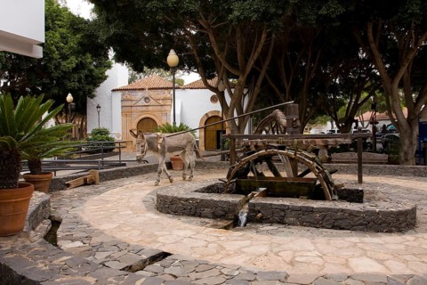Donkey driving watermill