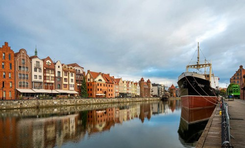 The old town of Gdansk with the first tanker built at the Gdansk shipyard