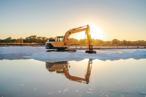 Excavator harvesting sea salt