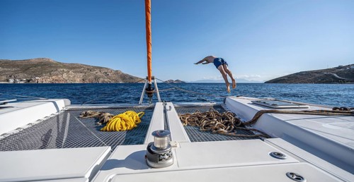 Young man jumps into the water
