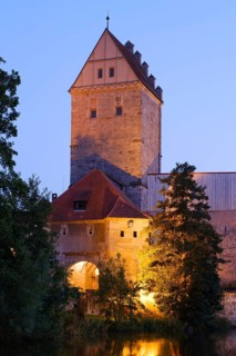 Illuminated Rothenburg Gate at dusk