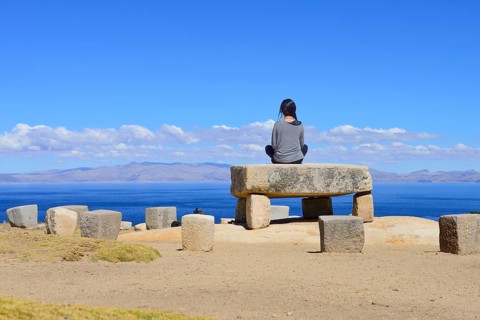 Woman sitting on the Roca Sagrada