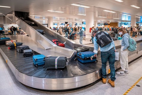 People waiting at baggage claim at an airport