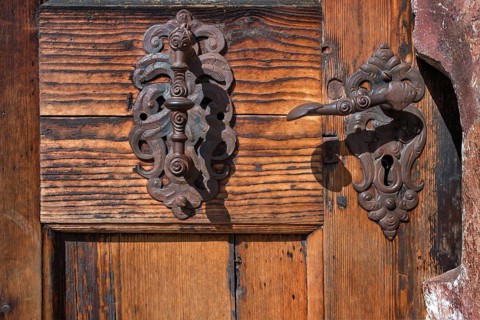 Old iron roof beacons at the gate of the chapel in the courtyard of Blutenburg Palace