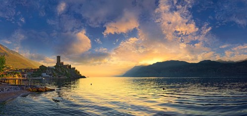 Historic coastal town of Malcesine with the Castello Scaligero castle at sunset