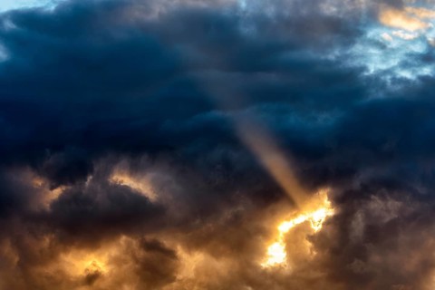 Sunbeam through gap in clouds