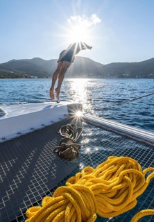 Young man jumps into the water