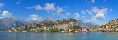 Coastal town panorama with colourful houses and the rocky mountain Monte Brione