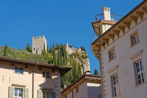 View from Piazza Novembre to the medieval castle ruins Castello di Arco
