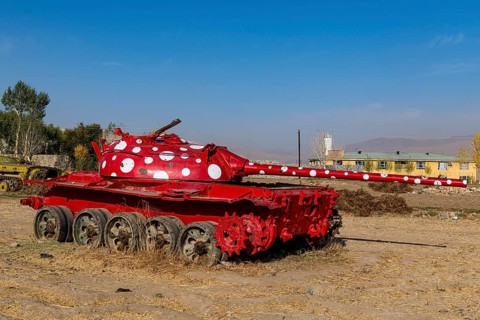 Old soviet tank coloured in funky colours