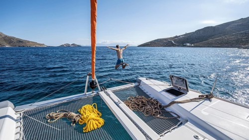 Young man jumps into the water