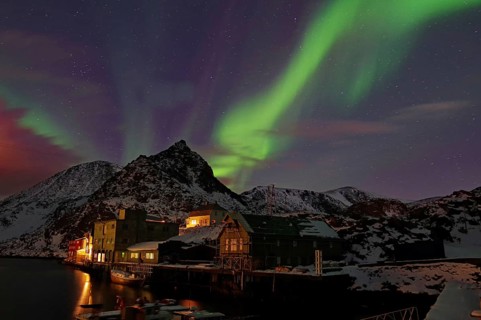 Small harbour with illuminated houses