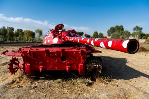 Old soviet tank coloured in funky colours