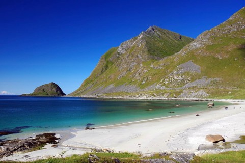 Wide sandy beach and crystal clear water