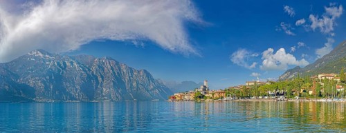 Historic coastal town of Malcesine with Castello Scaligero castle and bizarre cloudy sky