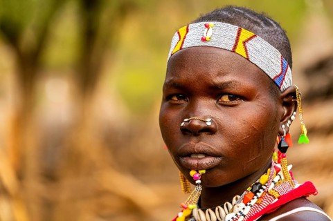 Traditional dressed young girl from the Laarim tribe