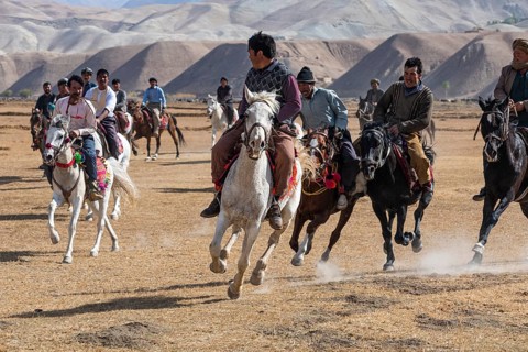Men practising a traditional Buzkashi game