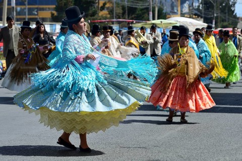 Dance group in traditional costumes at a parade