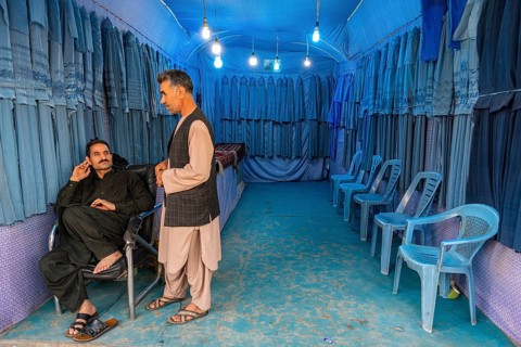 Men in their Burqa shop in Herat