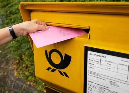 Election letter is put into Deutsche Post letterbox