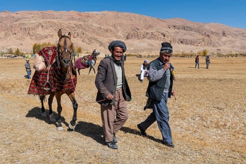 Old men with their horses at a Buzkashi game
