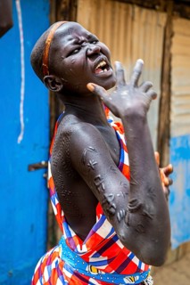 Girl with body scars from the Laarim tribe