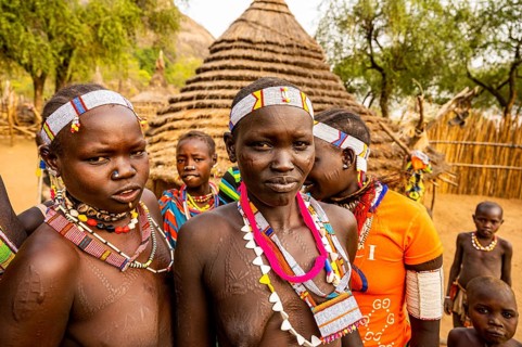 Traditional dressed young girls from the Laarim tribe