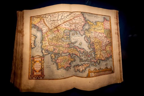 Antique book with an old map of Greece