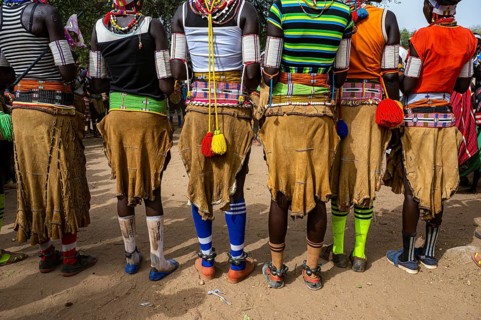 Close up from the cow skin skirs of traditional dressed young girls practising local dances