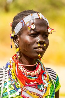 Traditional dressed young girl from the Laarim tribe