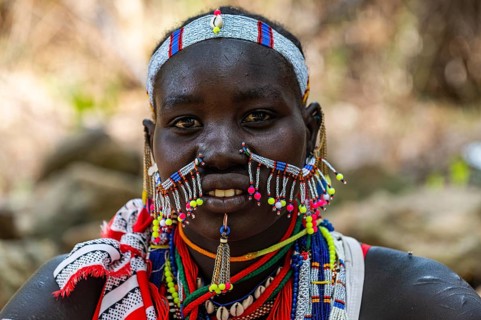 Traditional dressed young girl from the Laarim tribe