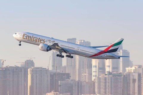 An Emirates Boeing 777-300ER aircraft with registration A6-EBK takes off from Dubai Airport