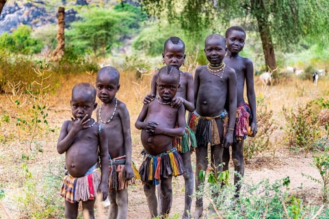 Young children standing in a row