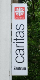Sign and logo Caritas
