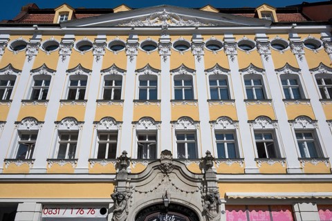 Facade with atlases
