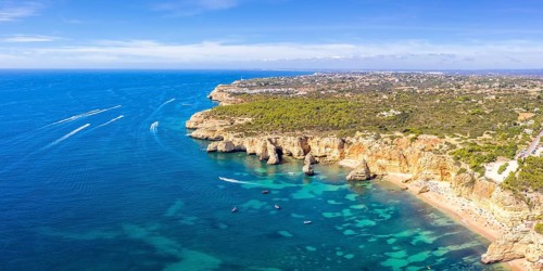 Portugal Algarve beach Praia da Marinha panorama sea ocean drone shot from above in Praia da Marinha