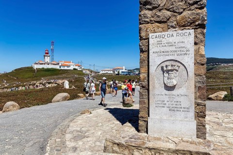 Tourists at the monument with information board
