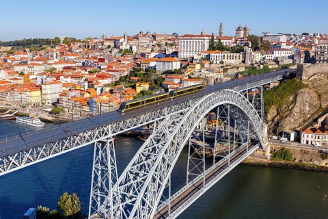 Porto with bridge Ponte Dom Luis I over river Douro and tramway travel city in Porto