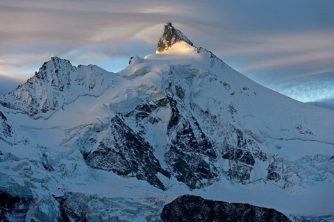 Sunset at the summit of Zinalrothorn