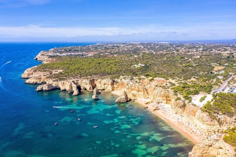 Portugal Algarve beach Praia da Marinha sea ocean drone shot from above in Praia da Marinha
