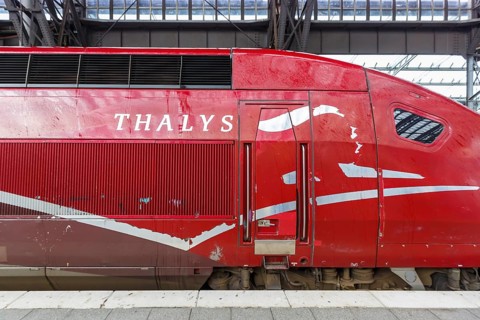 Thalys logo train high speed train powerhead locomotive in the station central railway station Hbf in Cologne